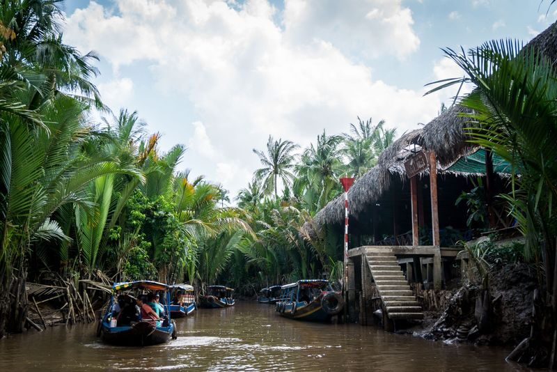 Cu Chi Tunnels & Mekong Delta Day Tour - Honey tea, coconut candy, and folk music