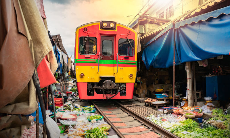 Damnoen Saduak Floating Market with Rowboat Ride + Train Ride at Maeklong Railway Market Tour by Panda Bus (LMK2) - Key points to know