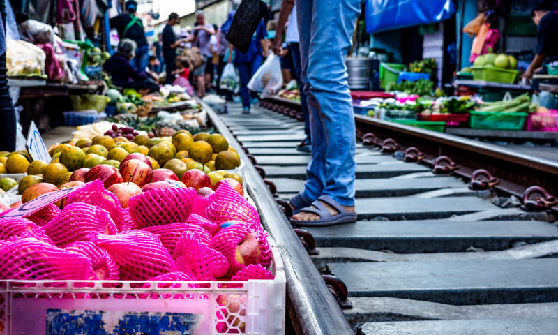 Damnoen Saduak Floating Market with Rowboat Ride + Train Ride at Maeklong Railway Market Tour by Panda Bus (LMK2) - Damnoen Saduak by hand-rowed boat