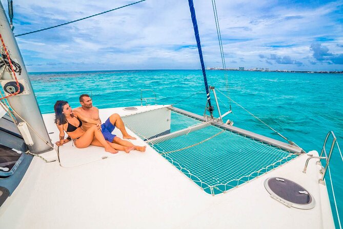 Deluxe Catamaran Tour to Isla.Mujeres! Open Bar, Lunch and Snorkeling Included - The Sum Up