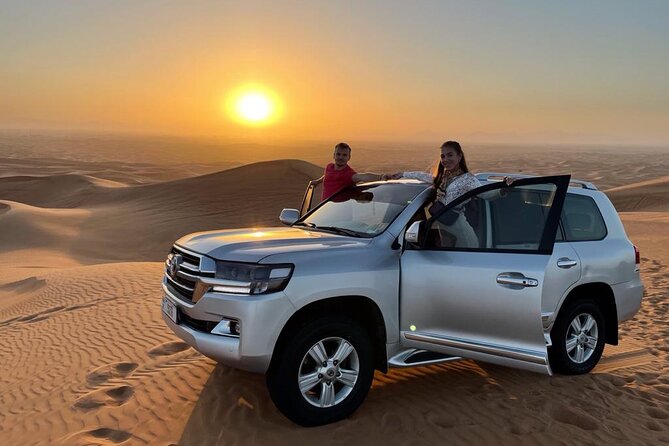 Desert Thrills: Dune Bashing, 30-min Quad Biking, Dances & BBQ - Sunset Stop and Dune Bashing