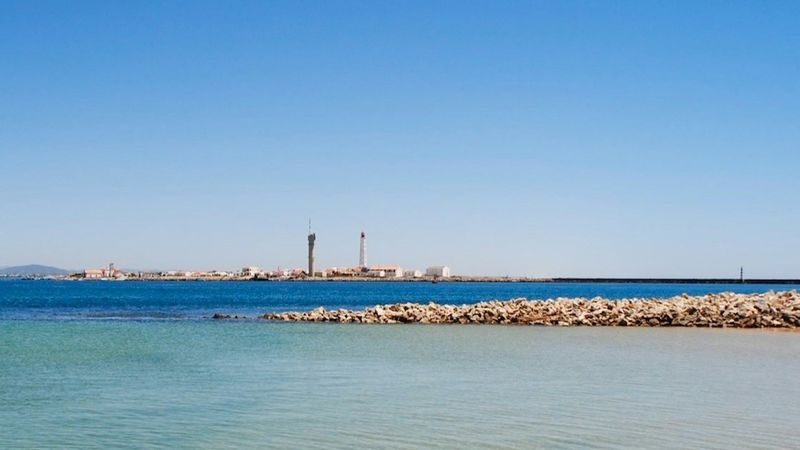 Deserta and Farol Islands boat tour from Faro - Farol Island: a lighthouse, homes and open beach