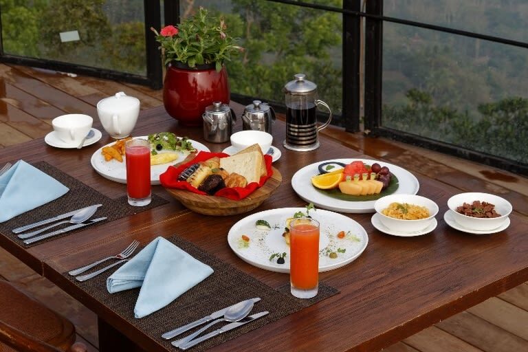 Dining Experience at Enam Langit by Plataran - A dining table with a view of Borobudur