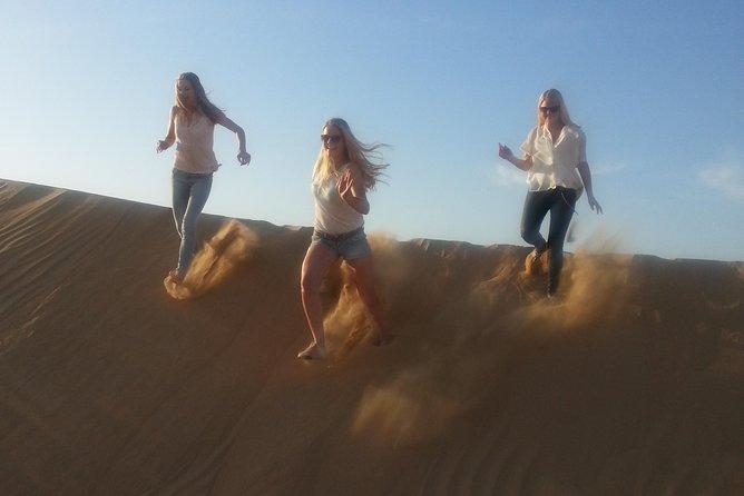 Dubai Desert Afternoon Quad Safari With Camel Ride, BBQ Dinner and Belly Dancing - Camel Ride and Bedouin-style Camp Visit
