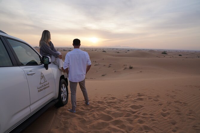 Dubai Desert Safari: Camel Ride, Sandboarding, BBQ & House Drinks - Positive Experiences and Criticisms
