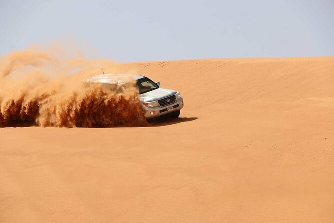 Dubai Desert Safari Red Dune: BBQ, Camel Ride & Sandboarding - Barbecue Dinner and Entertainment