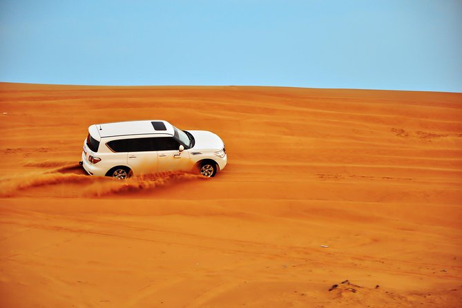 Dubai Desert Safari ,Tanura, Fire Show ,Belly Dance & BBQ Dinner - Exciting Dune Bashing Adventure