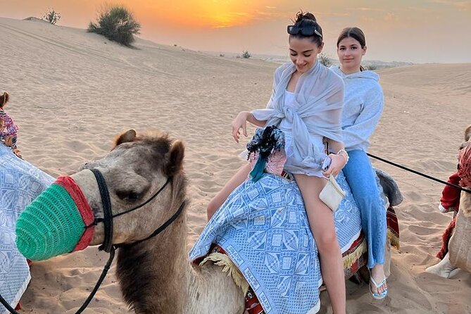 Dubai Dune Bashing With Camel Ride, Sandboarding & BBQ Dinner - Camel Ride Adventure
