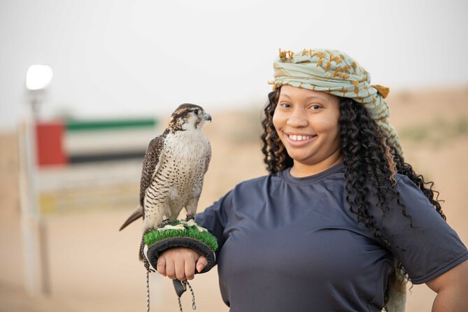 Dubai Half-Day Red Dunes Bashing With Sandboarding, Camel &Falcon - Get up Close With Majestic Falcons