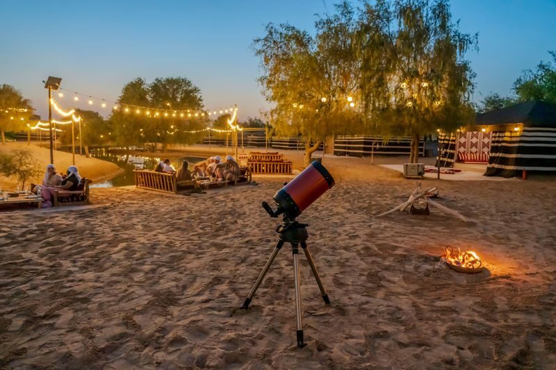 Dubai: Premium Night Desert Safari with Camel Ride & Stargazing - A lamplit camel walk