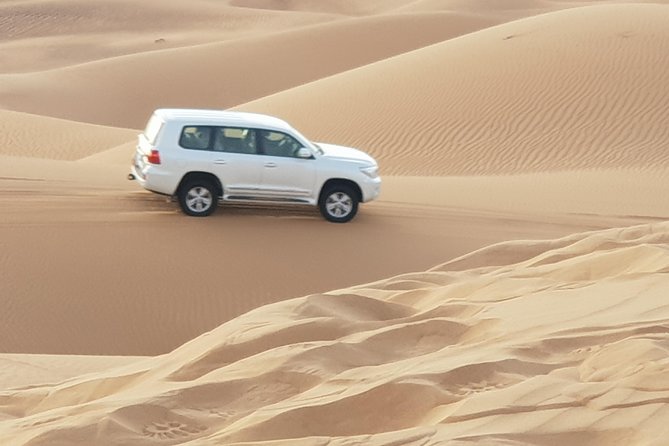 Dubai Red Dune Desert Safari, Sand Boarding, Quad Bike Ride - The Sum Up