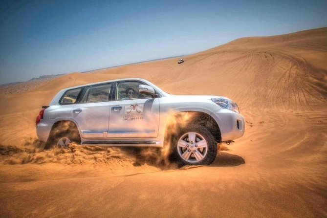 Dubai Red Dune Desert Safari With BBQ Dinner - Guide and Tour Service Details