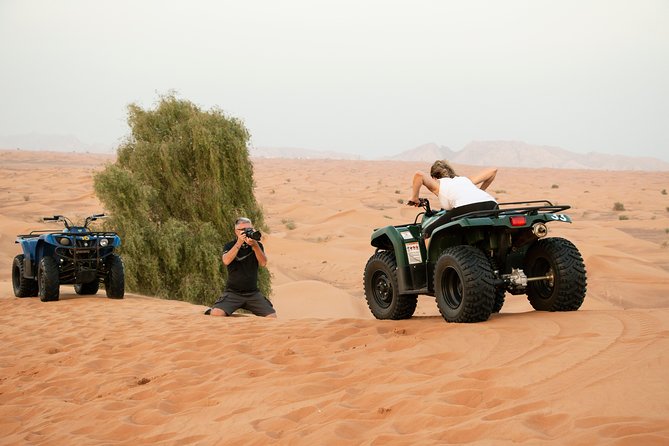 Dubai Red Dunes Quad Bike Safari, Camels, Sandsurf & Refreshment - The Sum Up
