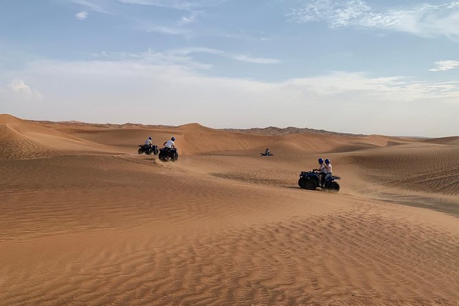 Dubai: Unique SUNSET Quad Bike Red Dunes Safari - Pricing and Booking