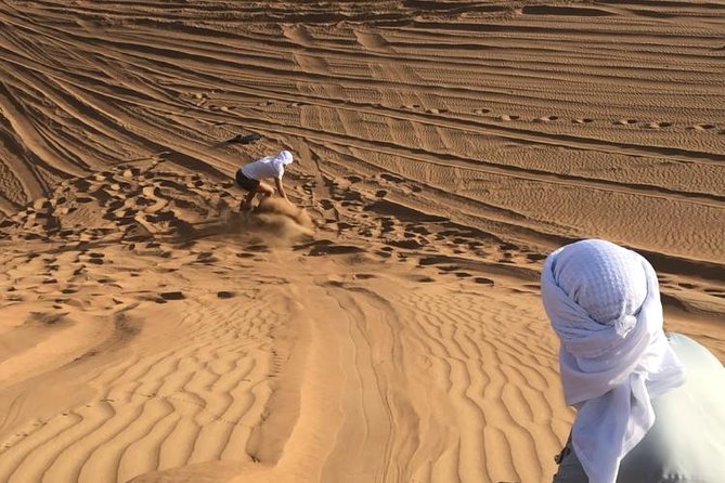 Dubai: Unique SUNSET Quad Bike Red Dunes Safari - Meeting and Pickup