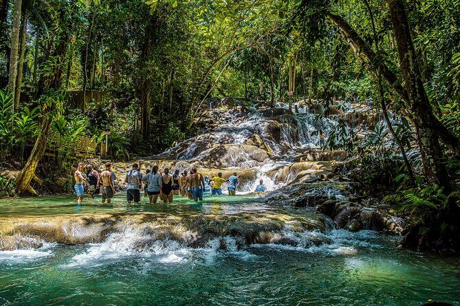Dunns River Falls and Zipline with Roundtrip Transfers - Exploring the Dunns River Falls and Zipline Tour: An Authentic Jamaican Adventure