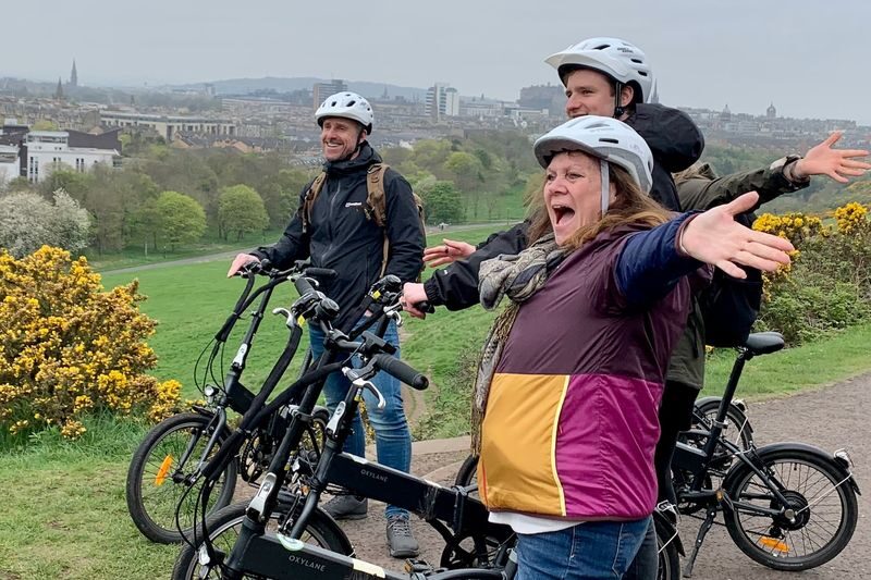 Edinburgh by E-Bike: Hidden Castles, Panoramic Views & Stories - Downhill to Holyrood Palace and Parliament