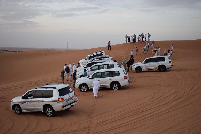 Evening Desert Safari Dubai - Sandboarding Down Large Dunes