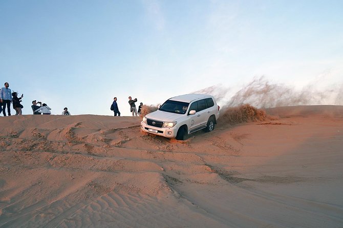 Exclusive Sunrise Desert Safari With Camel Ride Sand Boarding Dune Bashing - Convenient Cancellation Policy and Pricing Details