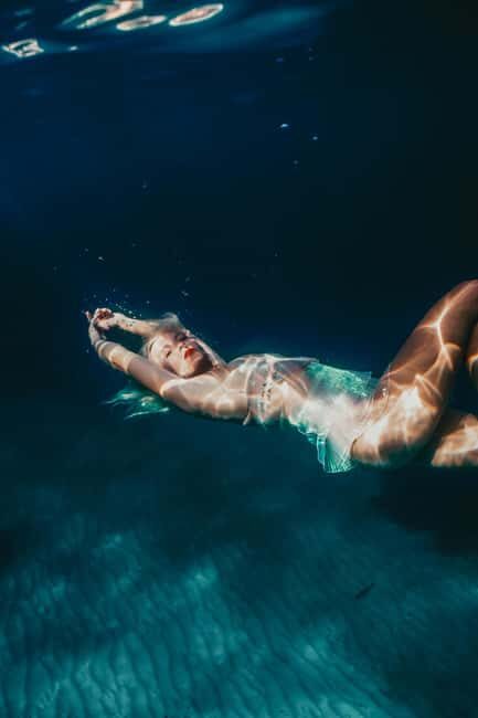 Exclusive underwater photo shoot in the sea near Palmain a turquoise blue bay - The Sum Up