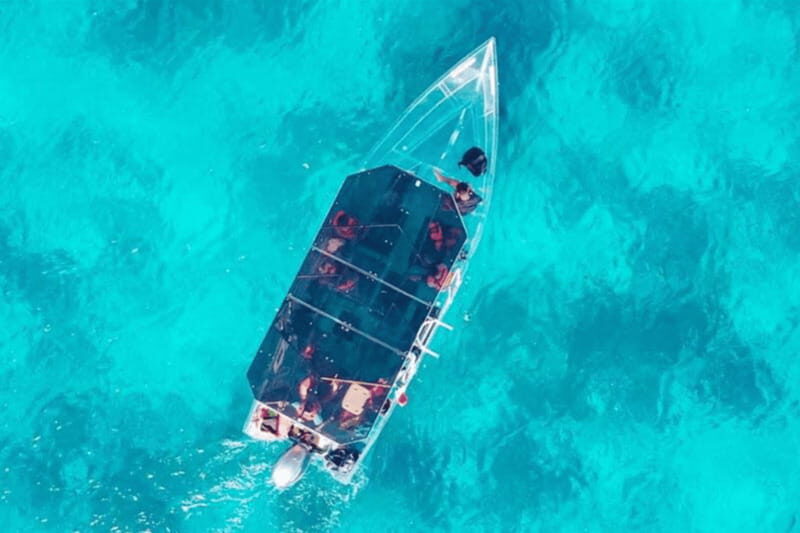 Explore the sea of cozumel in a transprent boat with drinks and snorkel. - The Itinerary in Detail