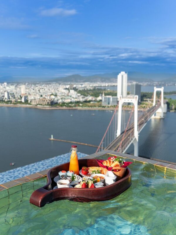 Floating Breakfast On Infinity Pool At Wyndham Danang Golden Bay - The view is the main course