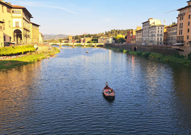 Florence Traditional Gondola Guided Boat Tour on the Arno River - A small wooden boat, not a motorized cruise