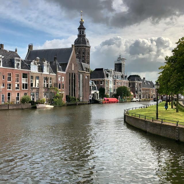 From Amsterdam: Delft and The Hague Private Day Tour - Strolling Through Delfts Picturesque Canals