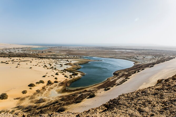 From Cairo: Desert Safari, Waterfalls, Sand Boarding and Camel Ride With Lunch - The Sum Up