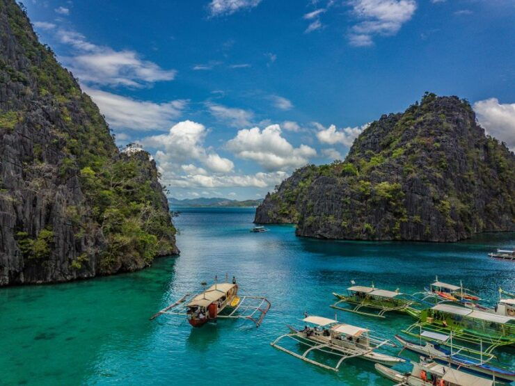 From Coron: Island Hopping Boat Day Trip With Buffet Lunch - Live Tour Guide and Pickup Options