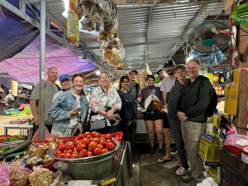 From Hoi An: Market Tour, Cooking Class & Lantern Making Experience - Guides who help the activities feel welcoming