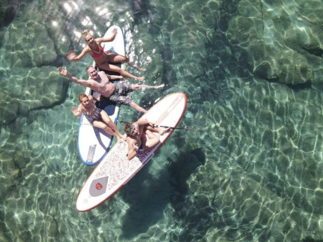 From Ornos: Rhenia Island Catamaran Cruise With Meal & SUP - Booking Information