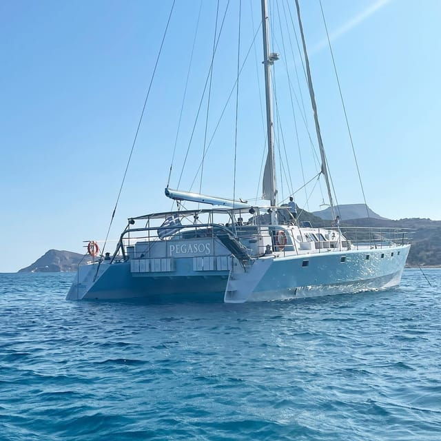 From Rhodes: Half-Day Catamaran Cruise With Swim Stops - Itinerary and Swim Stops