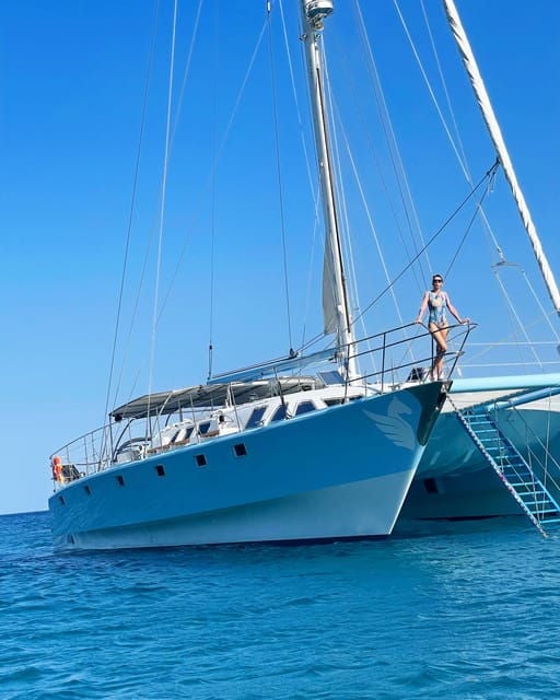 From Rhodes: Half-Day Catamaran Cruise With Swim Stops - Onboard Experience