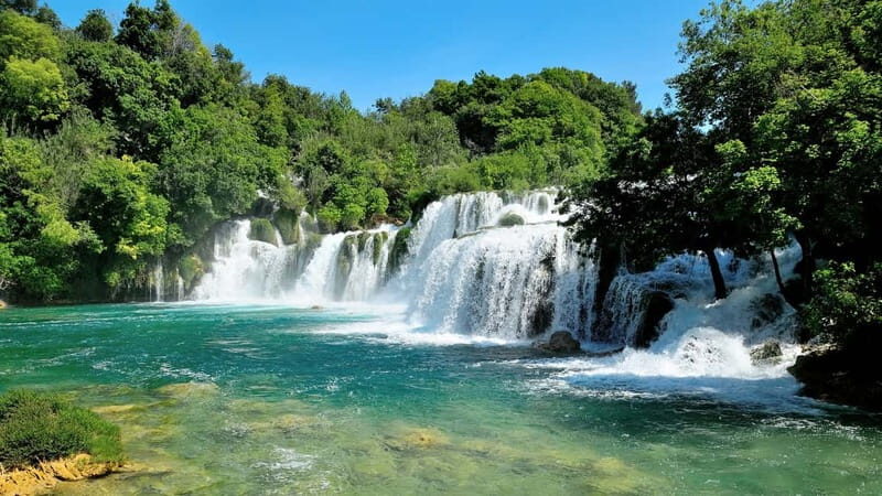 From Split: Krka Waterfalls with Riverboat Ride & swimm stop - Good To Know