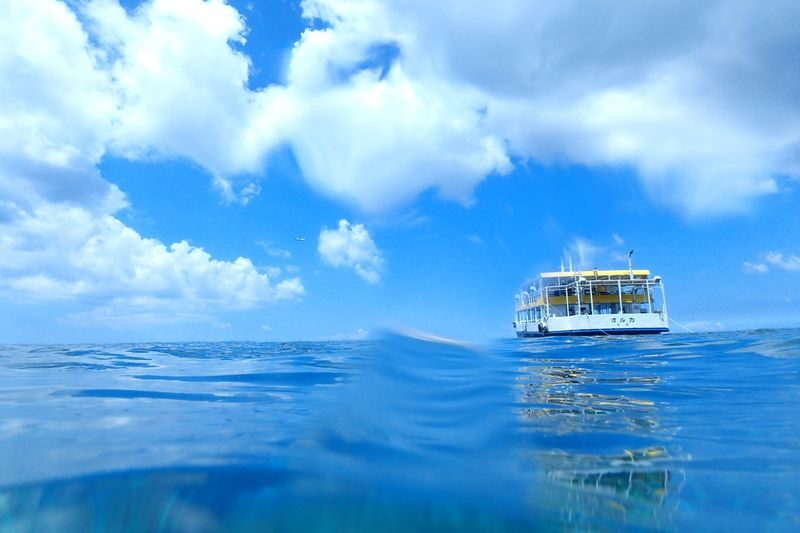 Glass Bottom Boat Tour in Okinawa - Enjoying the ride from the upper deck