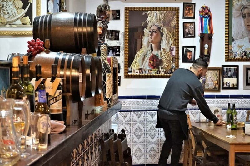 Granada: Traditional Tapas and Wine Tour - Walking Through Granada’s Iconic Food Scene