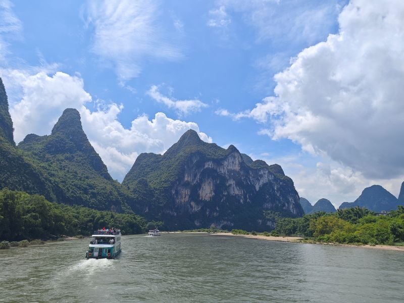 Guilin Li River + Yulong River Bamboo Raft + Impression Liu Sanjie Day Tour (Chartered Tour + Tickets + Li River Three/Four-Star Cruise) - A river day with three different moods
