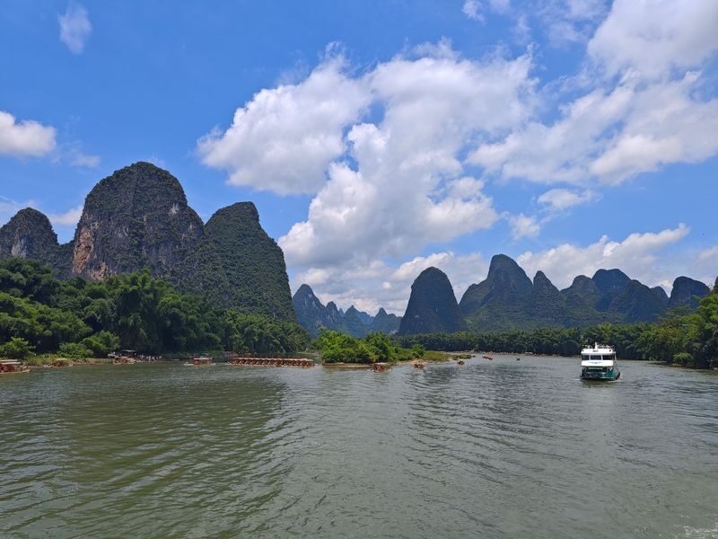 Guilin Li River + Yulong River Bamboo Raft + Impression Liu Sanjie Day Tour (Chartered Tour + Tickets + Li River Three/Four-Star Cruise) - The Liu Sanjie show after dark