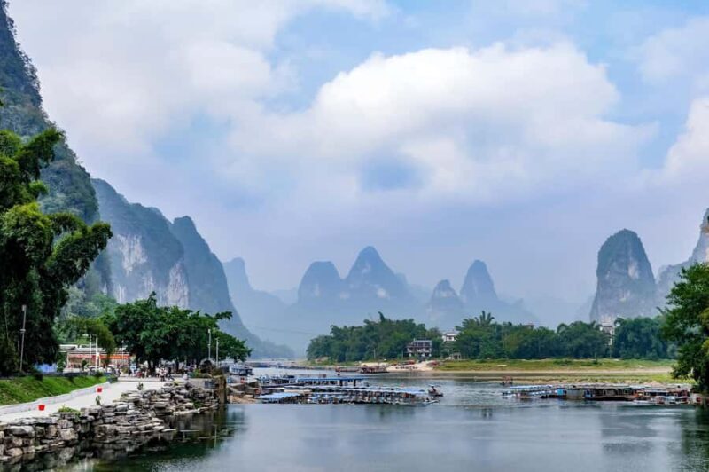 Guilin Yangshuo: Karst View, Bamboo Drifting & Train Sunset - Sunset and the Modern Skyline: Trains in Motion