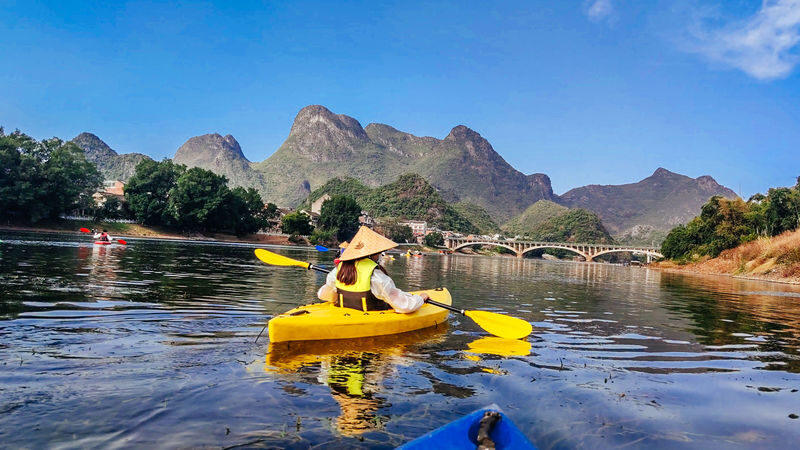 Guilin Yangshuo Outdoor Paddleboard/Kayak Experience Half-Day Tour (Minimum of 2 people) - On the river, Yangshuo feels quieter