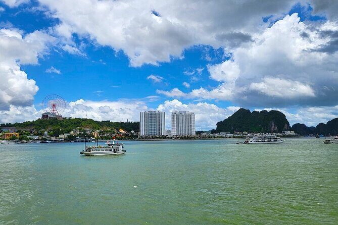 Ha Long Bay Sunset & Luxury Yacht Dinner with City Night Views - The Sum Up