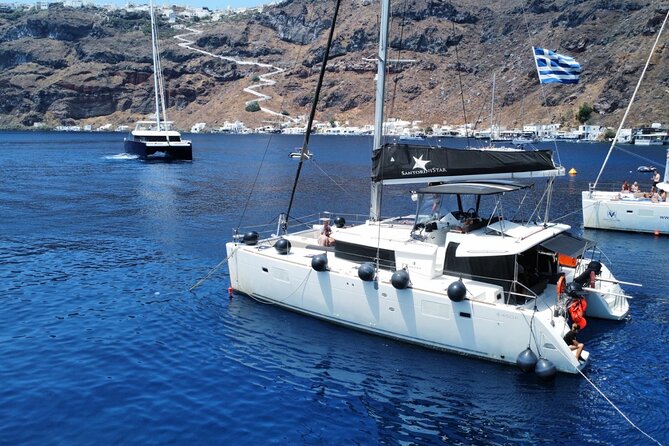 Half Day Premium Catamaran Cruise in Santorini Including Oia - Meeting and Pickup