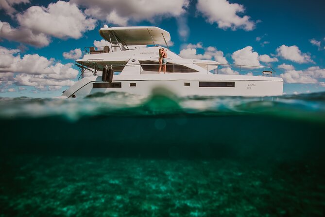 Half-Day Private Catamaran Charter From Puerto Aventuras  - Tulum - The Sum Up
