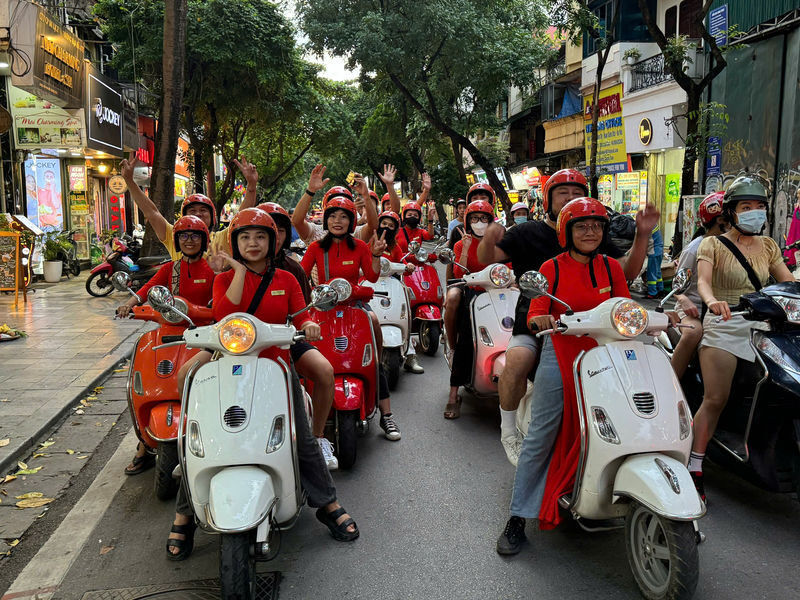 Hanoi Half-Day City Highlights Vespa Tour with Female Rider - A Vespa ride that links Hanoi’s many sides
