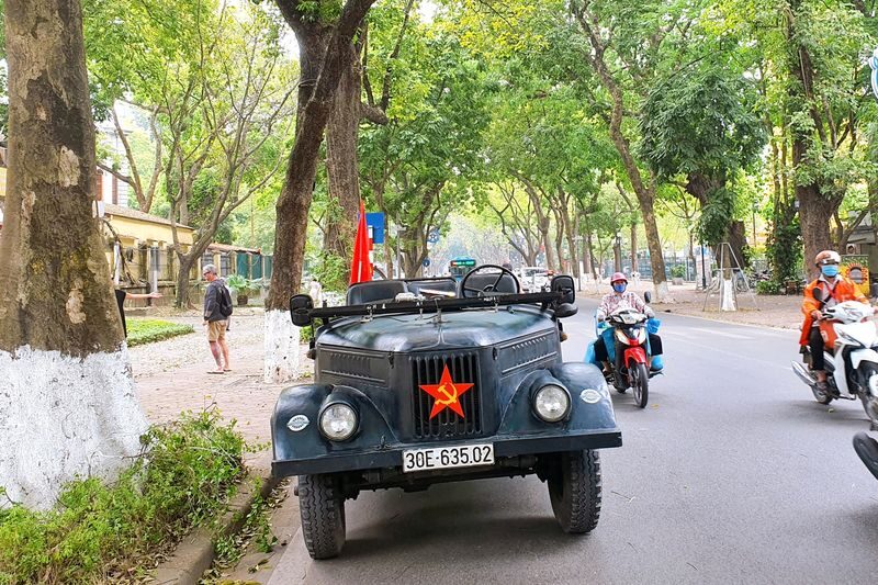Hanoi Half Day Tour With Train Street Visit & Food by Vintage Army Jeep - Hanoi from the seat of a vintage jeep