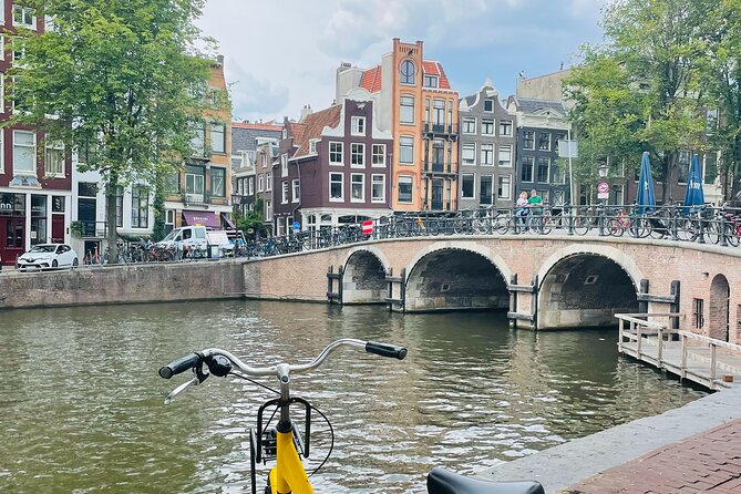 Highlights & Hidden Streets Bike Tour Amsterdam - Hidden Streets and Local Gems