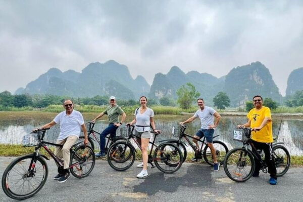 HOA LU - TAM COC - MUA CAVE - 1 DAY TRIP BY LIMOUSINE - Climbing Mua Cave