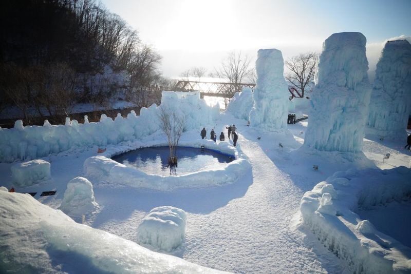 Hokkaido: Lake Shikotsu Ice Festival & Hoshino Tomamu Ice Village Day Trip | Depart from Sapporo - Chitose Salmon Park is a short local-food stop
