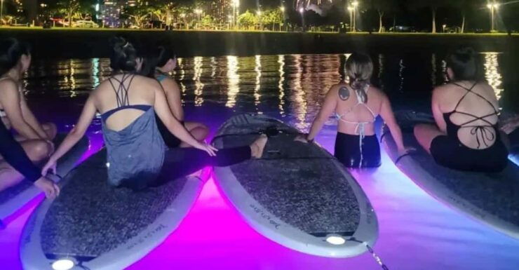 Honolulu: Fireworks Glow and Flow Yoga Class - Floating Yoga Illuminated by LED Lights